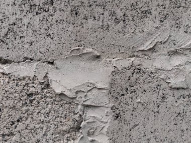 Gri kireçtaşı duvar tek renkli arka plan. Siyah ve beyaz taş ev beton çit dokusu. Metin işareti reklam tasarımı için boşluk kopyala. Kentsel mimari detayı grunge desenli arkaplan