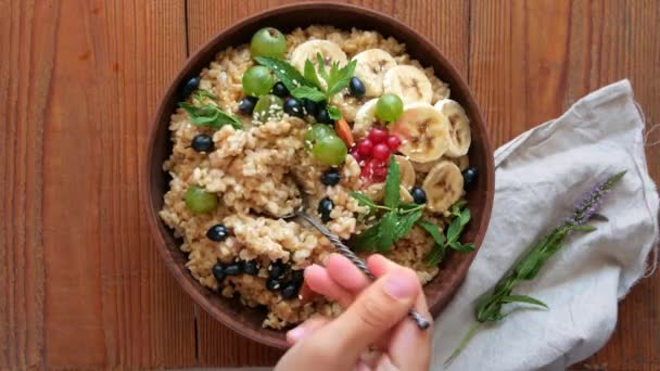 Wholegrain Oatmeal Porridge Fresh Berries Fruits Nuts Mint Leaves Sesame — Stock Video