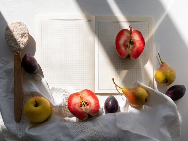 Autumn Flat Lay Open Cookbook Red Apple Pear Plum White — Stock Photo, Image