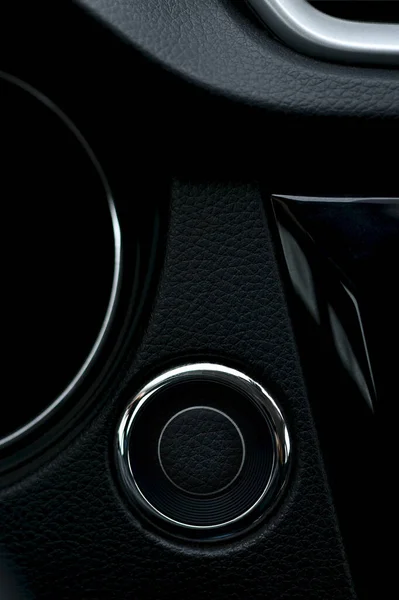 Fragment of a part of a black car panel. Round button start and stop ignition. — Stock Photo, Image