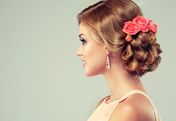 Beautiful female with elegant hairstyle. 