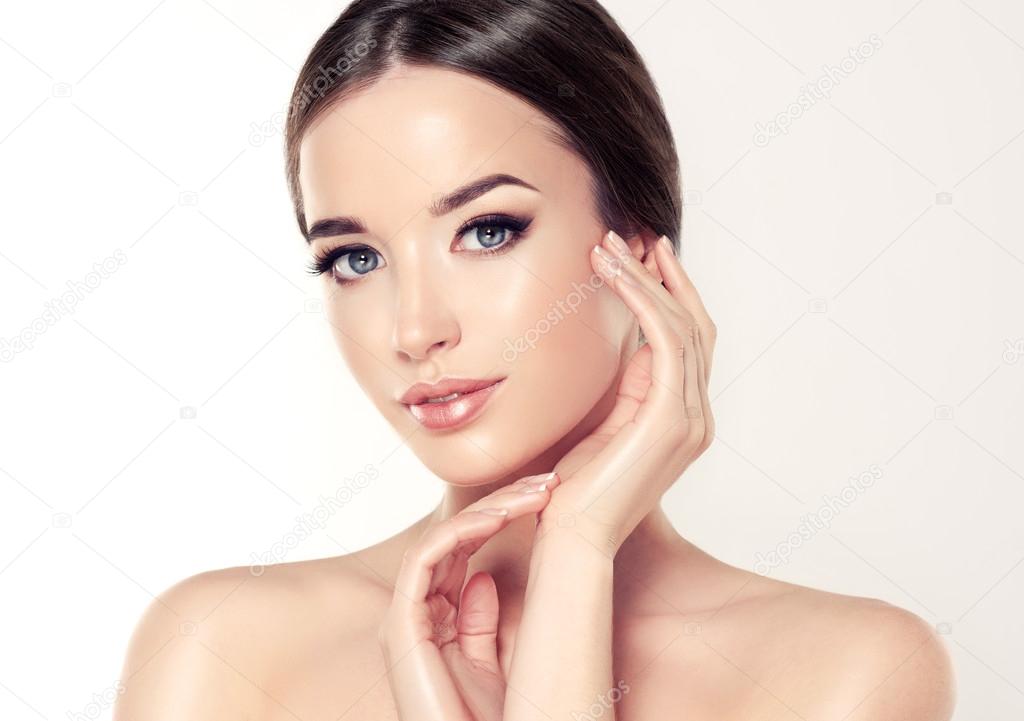 Woman face with young healthy skin