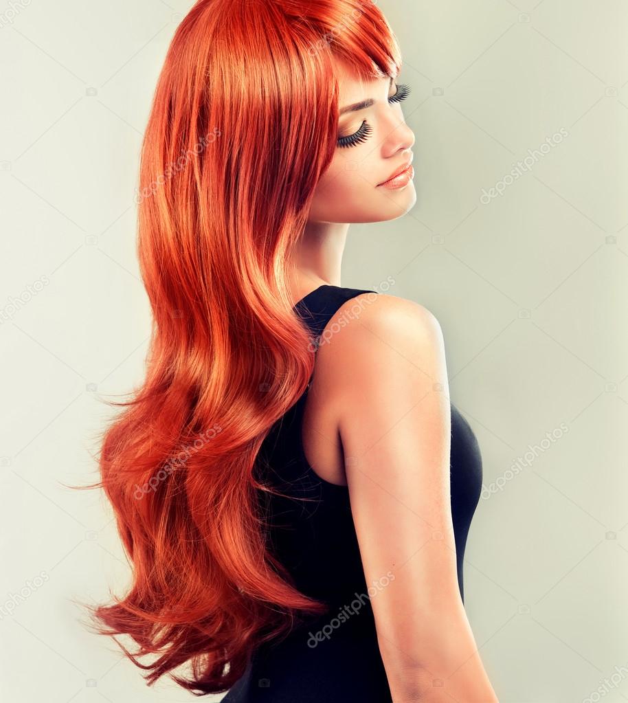 Girl with beautiful and shiny red hair