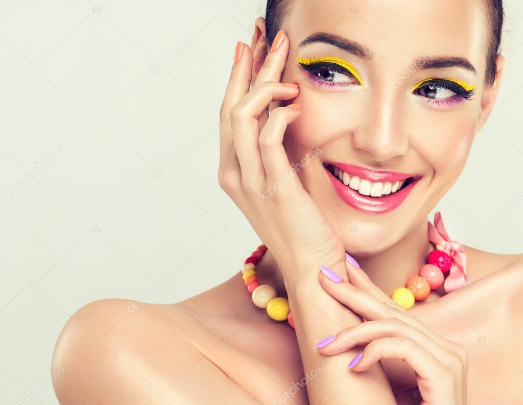 Laughing model with bright make-up
