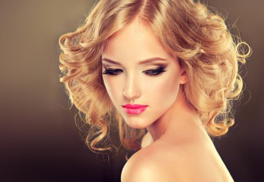 Blonde girl with luxury hairstyle and makeup clipart