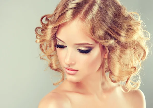 Blonde girl with hairstyle curled hair — Stock Photo, Image