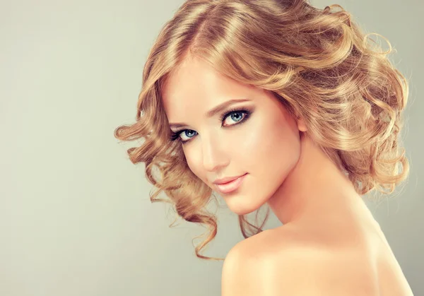 Blonde girl with hairstyle curled hair — Stock Photo, Image