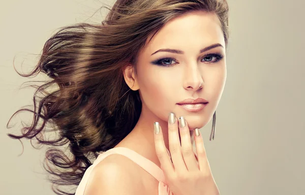 Beautiful woman with long curly hair — Stock Photo, Image