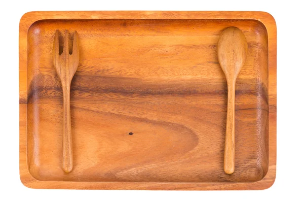 Dřevěná deska s lžící a vidličkou izolovaných na bílém pozadí — Stock fotografie