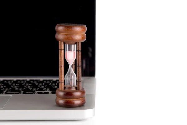 Hourglass with laptop - time concept — Stock Photo, Image