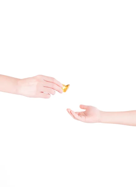 Adult's Hand Giving A Chinese Gold Isolated On White Background — Stock Photo, Image