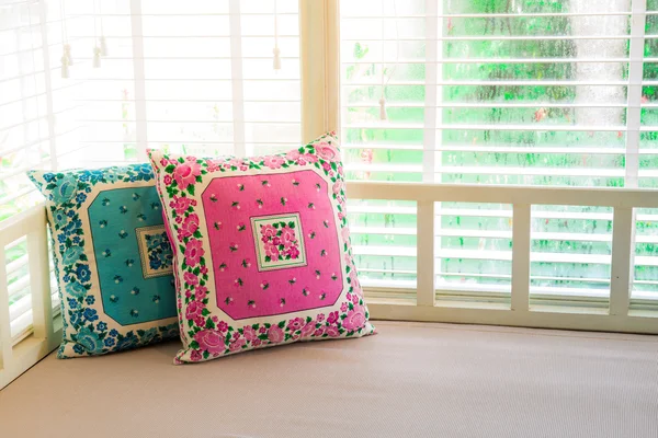 Pillows on day bed with sunlight — Stock Photo, Image