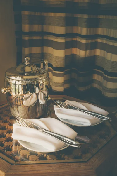 Stainless Ice Bucket and table setting with sunlight — Stock Photo, Image