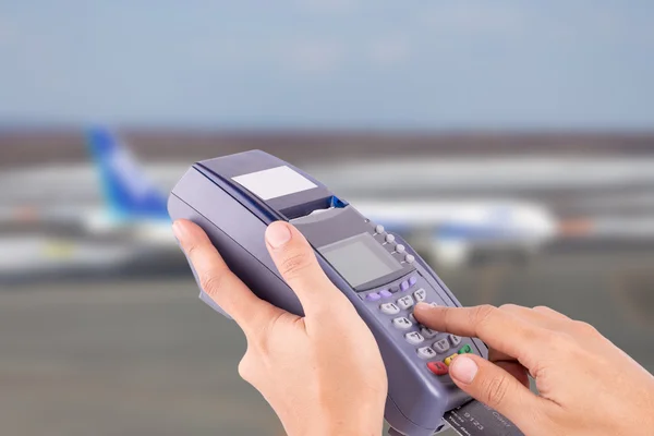 hand with credit card swipe through terminal for sale airplane t