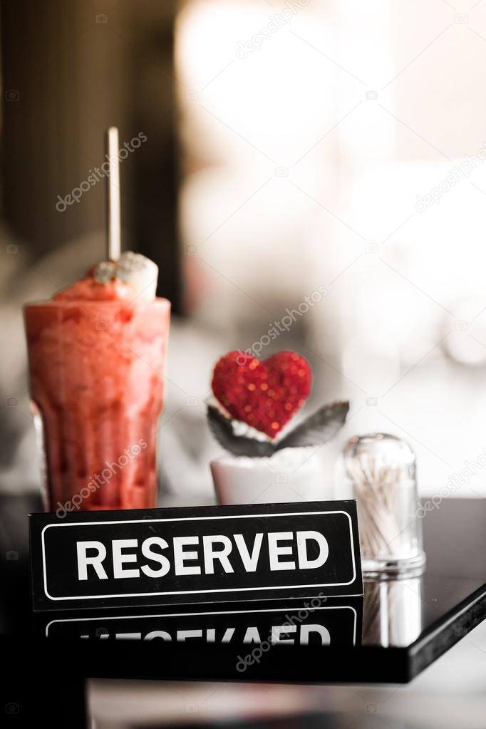 Vintage Styled Image Of A Reserved Sign On A Table In Restaurant