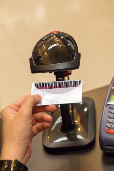 Black Barcode Scanning Member Card on Human Hand