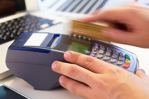 Hand Swiping Credit Card In Store : Selective Focus