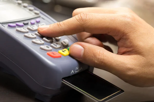 Close Up Of Hand With Credit Card Swipe Through Terminal For Sal — Stock Photo, Image