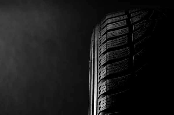 Tire on black — Stock Photo, Image