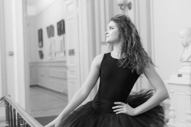 Black and white photo of flexible slender young girl ballerina. BW