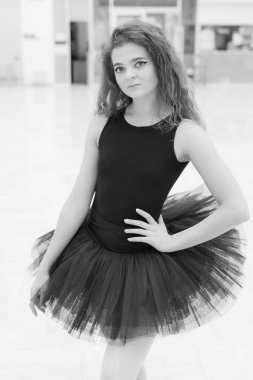 Black and white photo of flexible slender young girl ballerina. BW