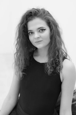 Black and white photo of flexible slender young girl ballerina. BW