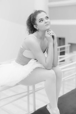 Black and white photo of flexible slender young girl ballerina. BW