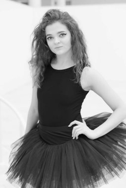 Black and white photo of flexible slender young girl ballerina. BW