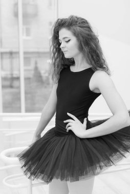 Black and white photo of flexible slender young girl ballerina. BW
