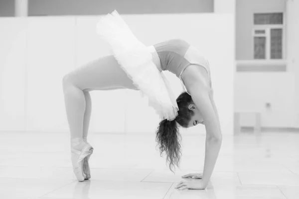 Black and white photo of flexible slender young girl ballerina. BW — Photo