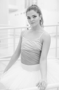 Black and white photo of flexible slender young girl ballerina. BW