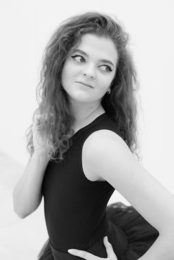 Black and white photo of flexible slender young girl ballerina. BW