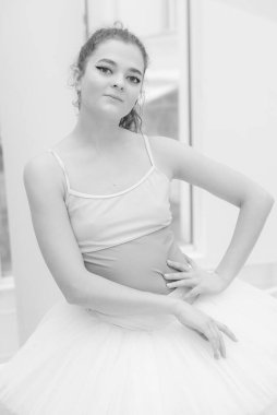 Black and white photo of flexible slender young girl ballerina. BW