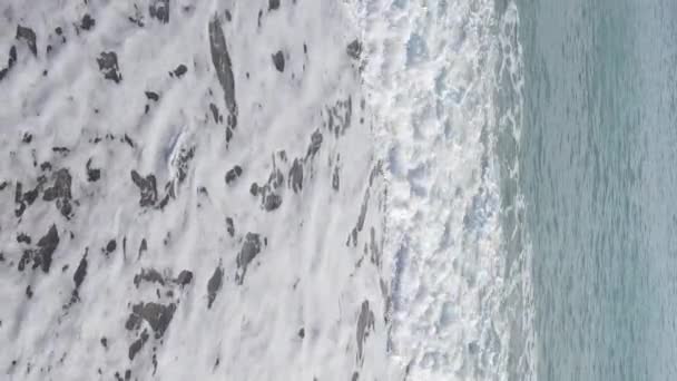 Vertical video sea near the coast - close-up of the coastal seascape. Slow motion — Stock Video