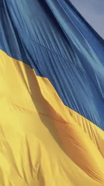 Vertical video National flag of Ukraine by day. Aerial view. — Stock Video