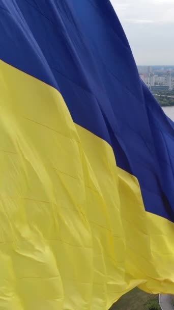 Vertical video National flag of Ukraine by day. Aerial view. — Stock Video