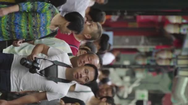 A crowd of people on the streets of the city. Beijing. China. Vertical video — Stock Video