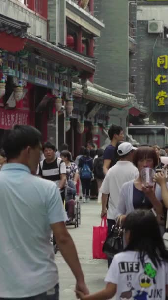 A crowd of people on the streets of the city. Beijing. China. Vertical video — Stock Video