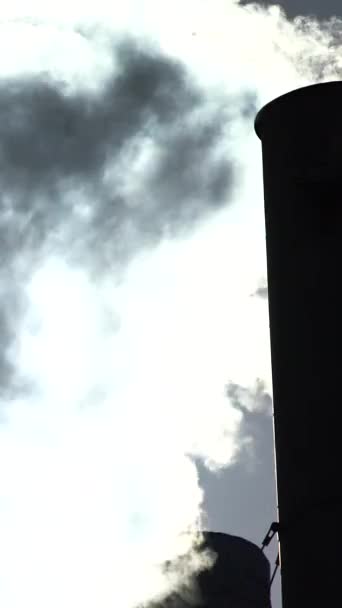 Smoke comes from the chimney. Vertical video — Stock Video