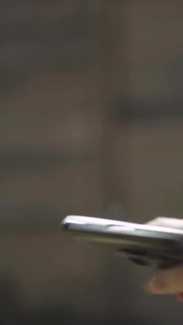 Close-up shot of a pistol. Vertical video — Stock Video