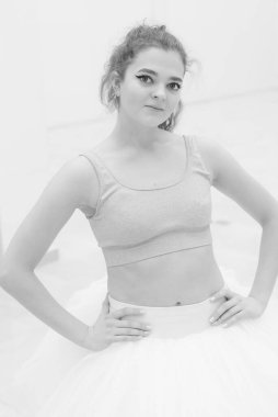 Black and white photo of flexible slender young girl ballerina. BW