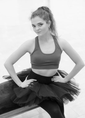 Black and white photo of flexible slender young girl ballerina. BW