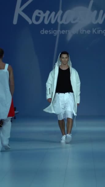 Male model walking on the catwalk Vertical video — Stock Video