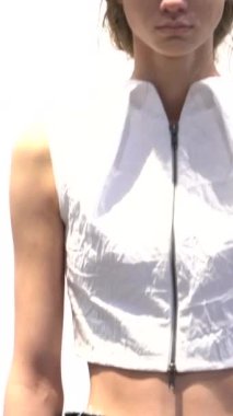 Woman model on the catwalk during a fashion show Vertical video
