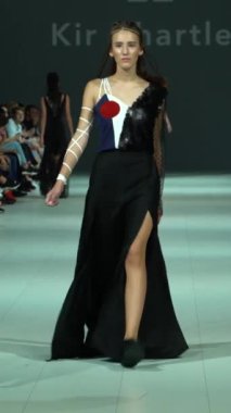 Woman model on the catwalk during a fashion show Vertical video