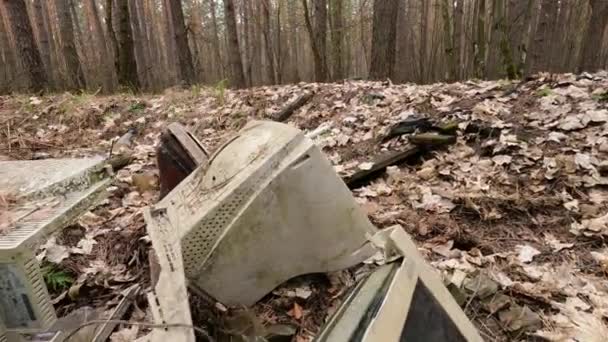 Old computer in a junkyard in the forest, slow motion — Stock Video