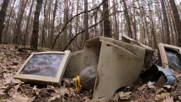 Old computer in a junkyard in the forest, slow motion — Stock Video