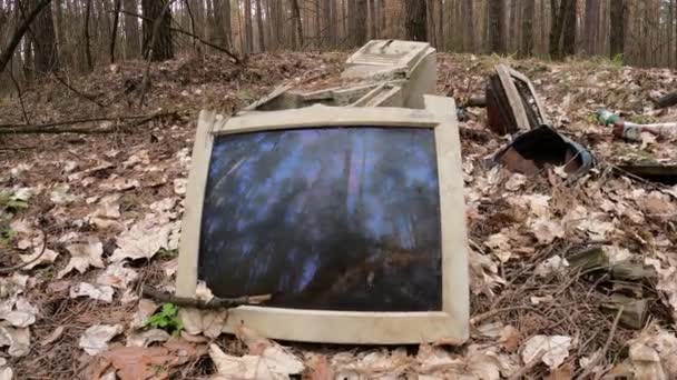 Old computer in a junkyard in the forest, slow motion — Stock Video