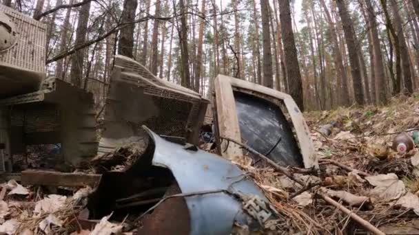 Old computer in a junkyard in the forest, slow motion — Stock Video