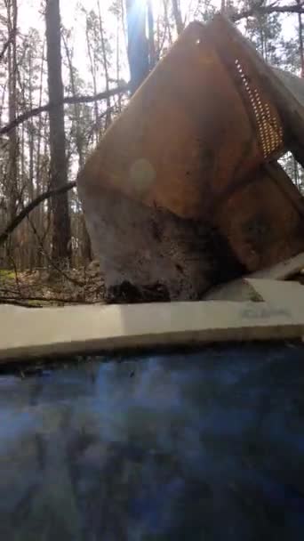 Vertical video of the computer in a junkyard in the forest, slow motion — Stock Video